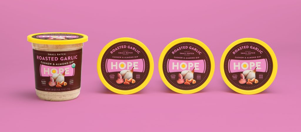 Four containers of Hope Roasted Garlic Cashew & Almond Dip in a line, packaging designed by EBD.
