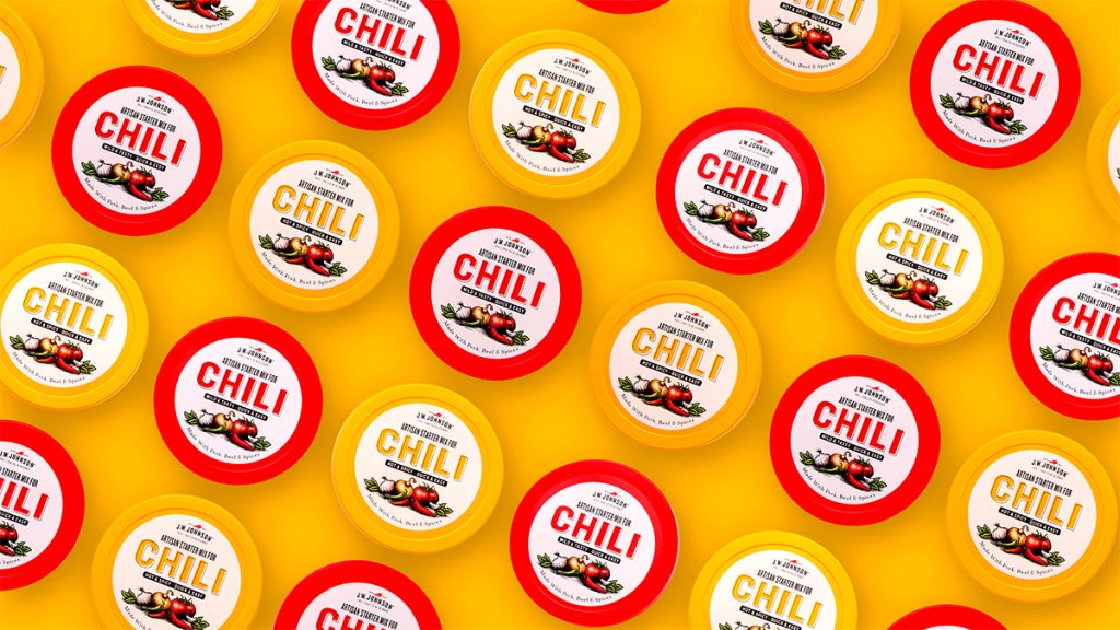 J.W. Johnson Chili packaging designed by EBD against a yellow background.
