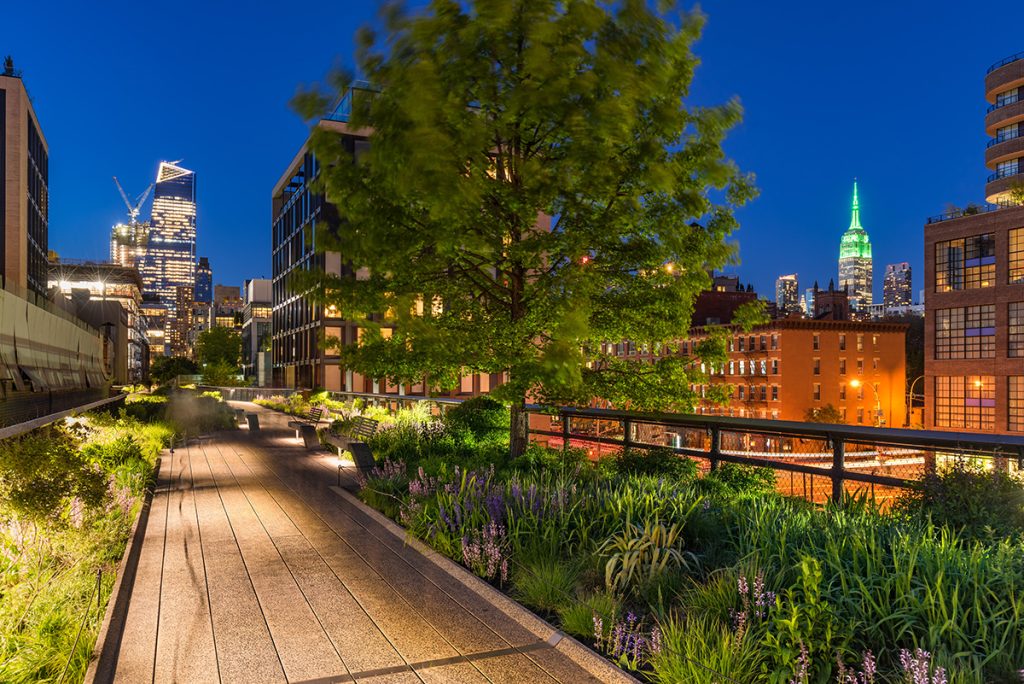 The High Line in New York City lit up at night.